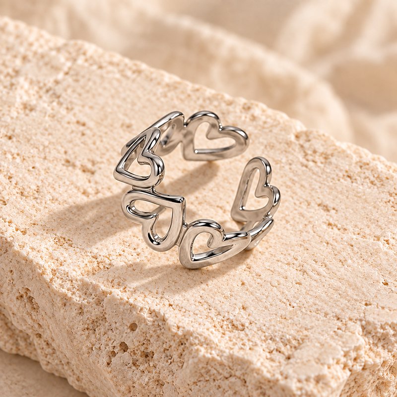 silver heart linked ring on travertine